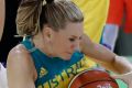 Australia guard Penny Taylor controls the loose ball during the second half of a women's basketball game against Belarus.