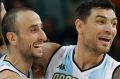 Argentina's Manu Ginobili, center, and Argentina's Carlos Delfino, right, celebrate with teammates after their win over ...