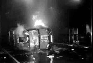 [ Photo of police van burning ]