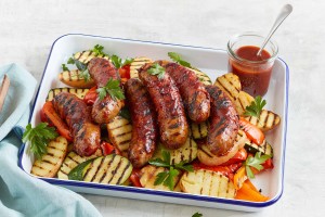 Beef sausages with smoky glaze and grilled vegetables