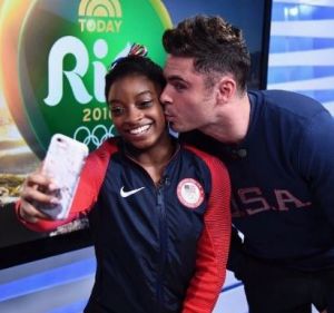 Zac Efron surprised US gymnast Simone Biles by flying to Rio to watch her compete.