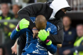 Worrying scenes: Ostersund goalkeeper Aly Keita is attacked on the pitch.