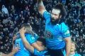 Aaron Woods finds air when celebrating the Blues' win.