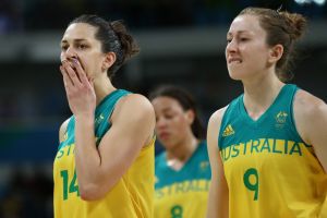 Canberra Capitals player Marianna Tolo (left) and Natalie Burton leave the court dejected after their quarter-final exit ...