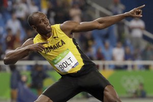 Usain Bolt from Jamaica celebrates winning the gold medal in the men's 200-meter final during the athletics competitions of the 2016 Summer Olympics at the Olympic stadium in Rio de Janeiro, Brazil, Thursday, Aug. 18, 2016.