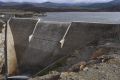 Cotter Dam might be close to full, but ACT residents may yet face rising water bills.

