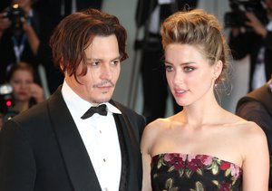 Johnny Depp and Amber Heard pose for photographers at the premiere of the film The Danish Girl during the 72nd edition of the Venice Film Festival in Venice, Italy, Saturday, Sept. 5, 2015. The 72nd edition of the festival runs until Sept. 12.