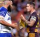 Tense exchange: Sam Kasiano and Corey Parker after the Brisbane captain appeared to be kicked in the face by the ...