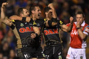 Runaway winners: Trent Merrin shares the joy after his try puts the result beyond doubt.