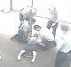 CCTV images appear to show a teenager with ankle-cuffs being held down at the Townsville centre.