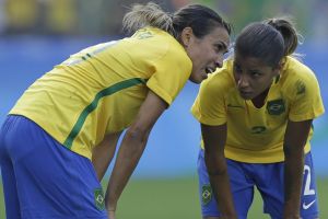 Brazil's Marta, left, and Fabiana talk before taking a free-kick.
