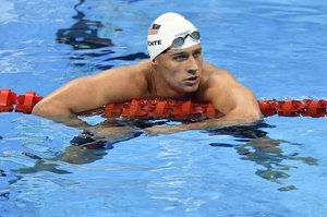 In this Aug. 9, 2016, file photo, United States' Ryan Lochte checks his time after a men' 4x200-meter freestyle relay heat during the swimming competitions at the 2016 Summer Olympics in Rio de Janeiro, Brazil. A Brazilian police official told The Associated Press that Lochte fabricated a story about being robbed at gunpoint in Rio de Janeiro.