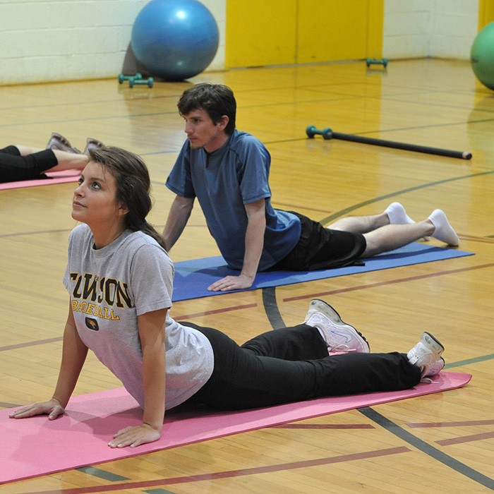 TU students practicing yoga