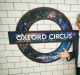 Mayor of London Sadiq Khan poses in front of a new Night Tube logo at Oxford Circus underground station.