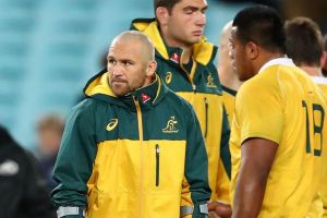 Miserable outing: Matt Giteau hobbled out of ANZ on crutches.