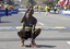 File - Wesley Korir of Kenya gestures after crossing the finish line to win the men's division of the 2012 Boston Marathon in Boston, Monday, April 16, 2012.