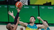 Bogut reaches for a rebound against Venezuela