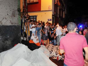 People react after an explosion in Gaziantep, southeastern Turkey, early Sunday, Aug. 21, 2016.