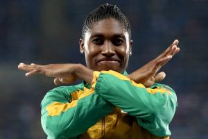 Caster Semenya brushes  the dust off her shoulders after the race.