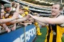 Xavier Ellis celebrates his 2008 Premiership with Hawthorn, in just his 36th AFL game. 