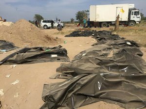 This Tuesday, April 7, 2015 photo shows human remains from a mass grave, believed to contain the bodies of Iraqi soldiers killed by Islamic State group militants when they overran Camp Speicher military base last June, in Tikrit, Iraq