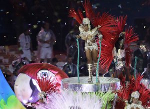 Plumed performers participate in the closing ceremony in the Maracana stadium at the 2016 Summer Olympics in Rio de Janeiro, Brazil, Sunday, Aug. 21, 2016.