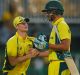 Australia's captain Steve Smith, second right, congratulates Mitchell Starc, after defeating Sri Lanka by three wickets ...