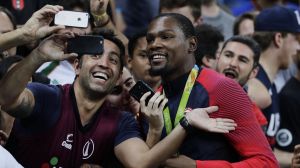 Smile: Kevin Durant takes selfies with fans after winning the men's basketball gold medal.