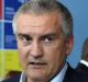 Sergey Aksyonov, "prime minister" of the autonomous republic of Crimea, right, attends the opening day of the St ...