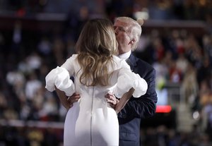 Republican Presidential Candidate Donald Trump kisses his wife Melania Trump as he introduces her during first day of the Republican National Convention in Cleveland