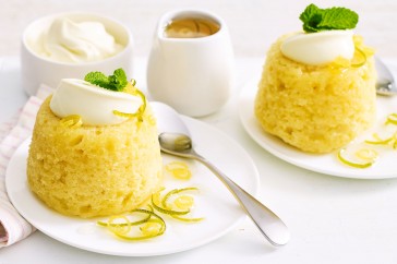 Lemon, lime and coconut steamed puddings with citrus syrup