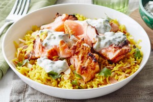 Curried salmon with turmeric rice and raita