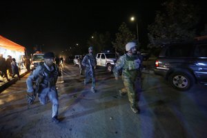 Afghan security forces rush to respond to a complex Taliban attack on the campus of the American University in the Afghan capital Kabul on Wednesday, Aug. 24, 2016.