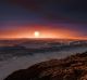 This artist?s impression shows a view of the surface of the planet Proxima b orbiting the red dwarf star Proxima ...