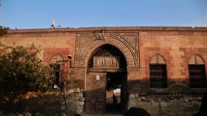 Children hang around a cemetery area near the Shahin Al-Khalwati Mosque in Cairo, Egypt.