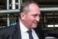 Barnaby Joyce talks with dairy farmer Ashley Galt and his wife Lucy Galt in May.