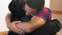 Marquez Tolbert hugs his mother.