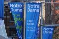 Notre Dame posters on Broadway looking towards Central in 2015.