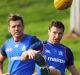 Brent 'Boomer' Harvey trains with Shaun Higgins (left) and Lindsay Thomas after learning he is to be delisted.