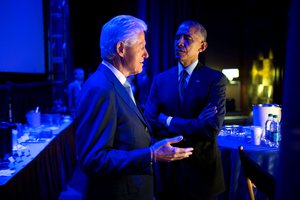 File - President Barack Obama speaks with former President Bill Clinton backstage prior to delivering remarks during the Clinton Global Initiative in New York, N.Y., Sept. 23, 2014.