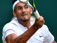 Australia's Nick Kyrgios returns to Britain's Andy