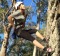 A climber ascends the rock face.

