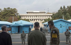 File - U.S. Marine Corps Gen. Joseph F. Dunford Jr., chairman of the Joint Chiefs of Staff, receives a briefing from U.S. Army Col. James Minnich during a visit to the Demilitarized Zone dividing the two Koreas, Nov. 2, 2015.