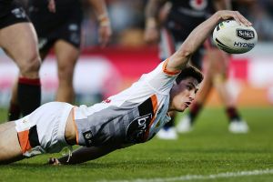 Full stretch: Mitchell Moses of the Tigers scores.