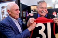 Paul Little with Ron Barassi and some of the AFL legend's memorabilia.