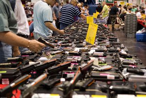 File - Guns on display at the Houston Gun show in the George R. Brown Convention Center, Texas.