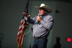 File - Cliven Bundy speaking at a forum hosted by the American Academy for Constitutional Education (AAFCE) at the Burke Basic School in Mesa, Arizona, 22 July 2014.