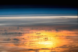 File - Expedition 47 Flight Engineer Jeff Williams of NASA captured a series of photos from the International Space Station on April 25, 2016, for this composite image of the setting sun reflected by the ocean.