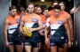 Co-captain Callan Ward leads out GWS. 