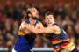 ADELAIDE, AUSTRALIA - AUGUST 26: Will Schofield of the Eagles and Josh Jenkins of the Crows compete during the round 23 ...